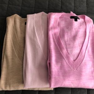 Three J Crew merino v-neck sweaters